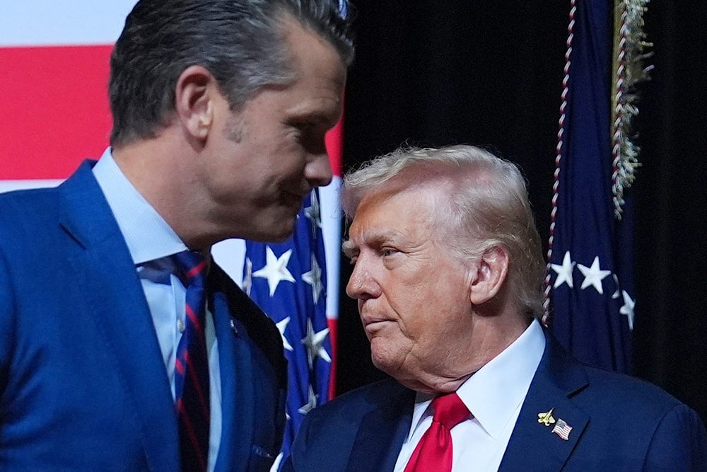 President Donald Trump is greeted by Secretary of Defense Pete Hegseth before speaking to a gathering of top US military commanders at Marine Corps Base Quantico, Tuesday, Sept. 30, 2025, in Quantico, Va (AP)