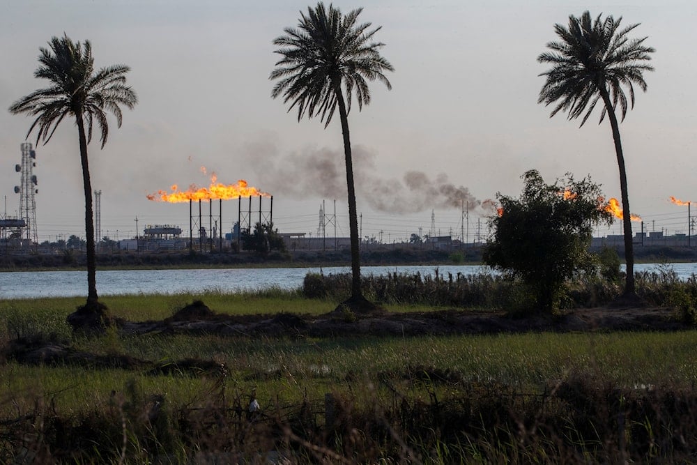 The Nihran Bin Omar oil field flare stacks burn north of Basra, Iraq, Wednesday, March 22, 2023 (AP)