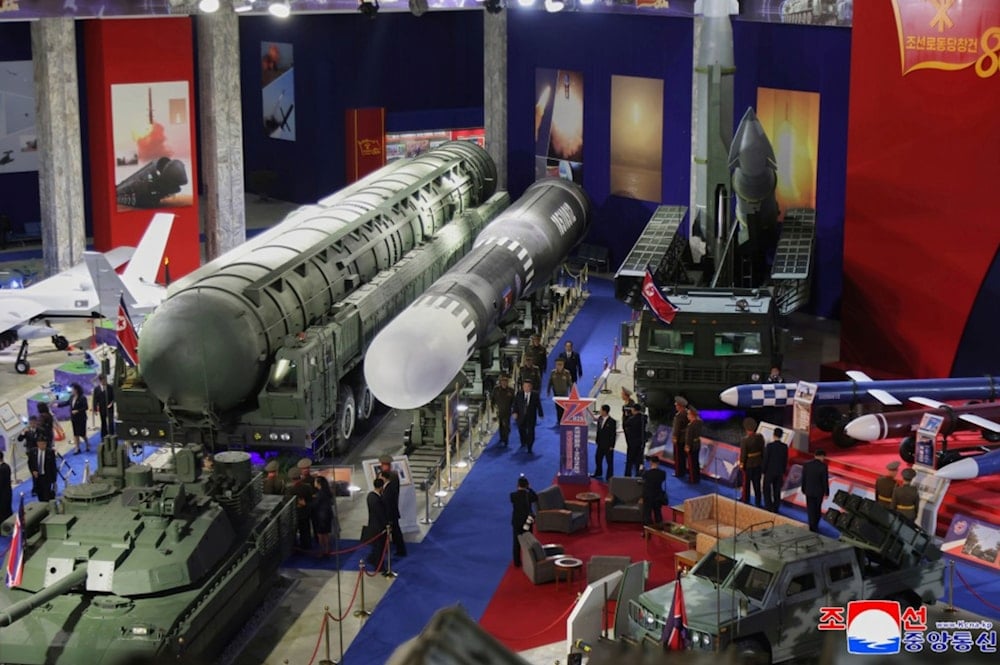 In this photo provided by the North Korean government, North Korean leader Kim Jong Un, center, visits a military hardware exhibition in Pyongyang, Notrh Korea Saturday, Oct. 4, 2025 (AP)