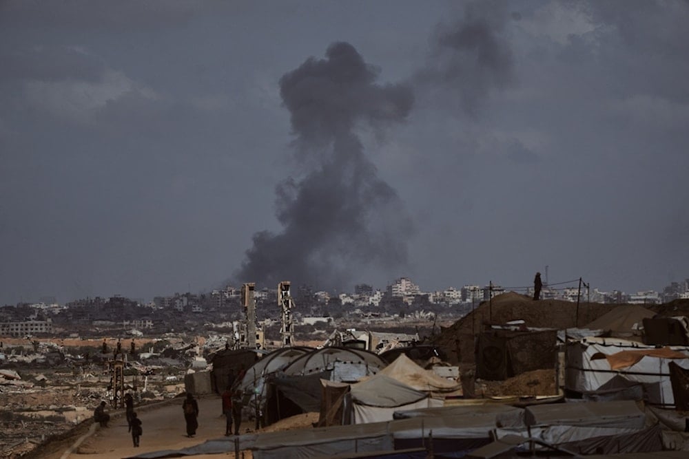 Smoke rises following an Israeli military strike in Gaza City, as seen from the central Gaza Strip, Sunday, October 5, 2025. (AP Photo/Abdel Kareem Hana)