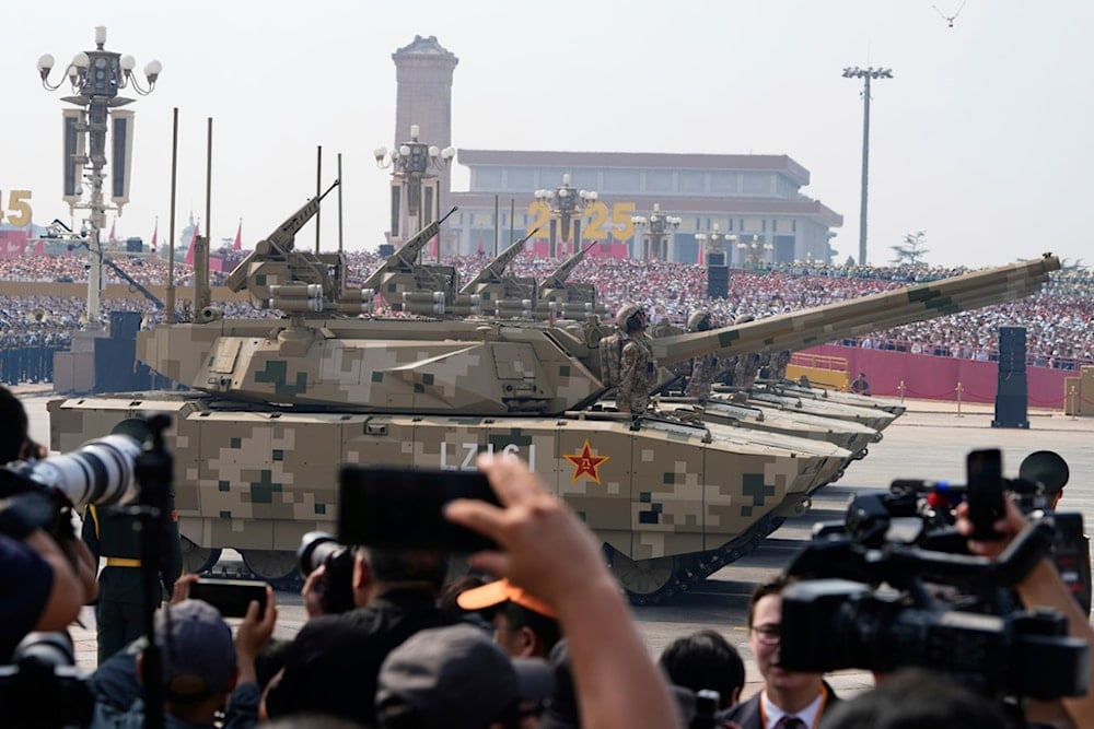 Armored vehicles take part in a military parade to commemorate the 80th anniversary of Japan's World War II surrender held in front of Tiananmen Gate in Beijing, Wednesday, September 3, 2025 (AP)