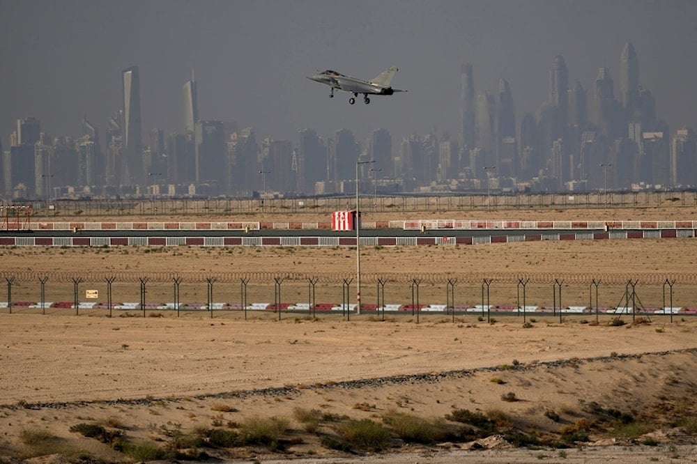 With the general view of the city skyline, a French Air Force Dassault Rafale C jet fighter prepares to land during the opening day of the Dubai Air Show, United Arab Emirates, Monday, November 13, 2023 (AP)