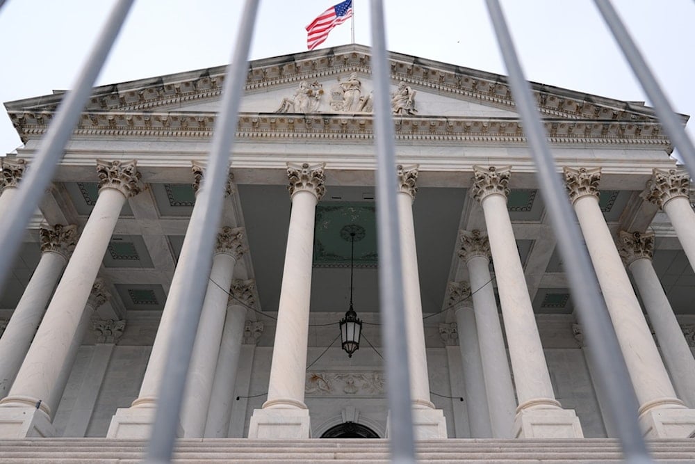 The American flag flies atop the Capitol Building, Monday, September 29, 2025, in Washington (AP)