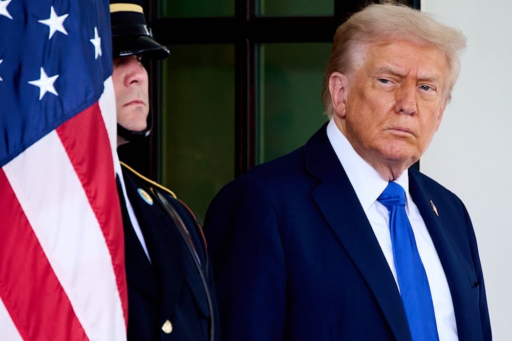 President Donald Trump waits to greet Canada's Prime Minister Mark Carney, as Carney arrives at the White House, Tuesday, Oct. 7, 2025, in Washington (AP)
