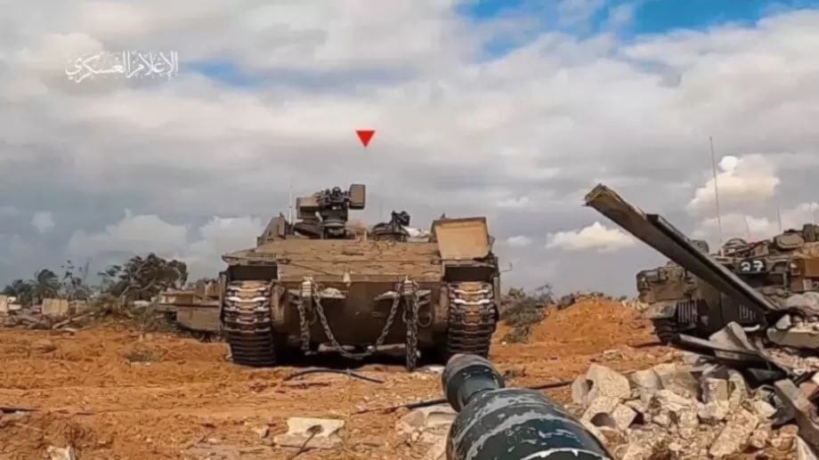 Al-Qassam Brigades fighters target an Israeli tank in the Gaza Strip in an undated photograph (Al-Qassam Brigades Military Media)