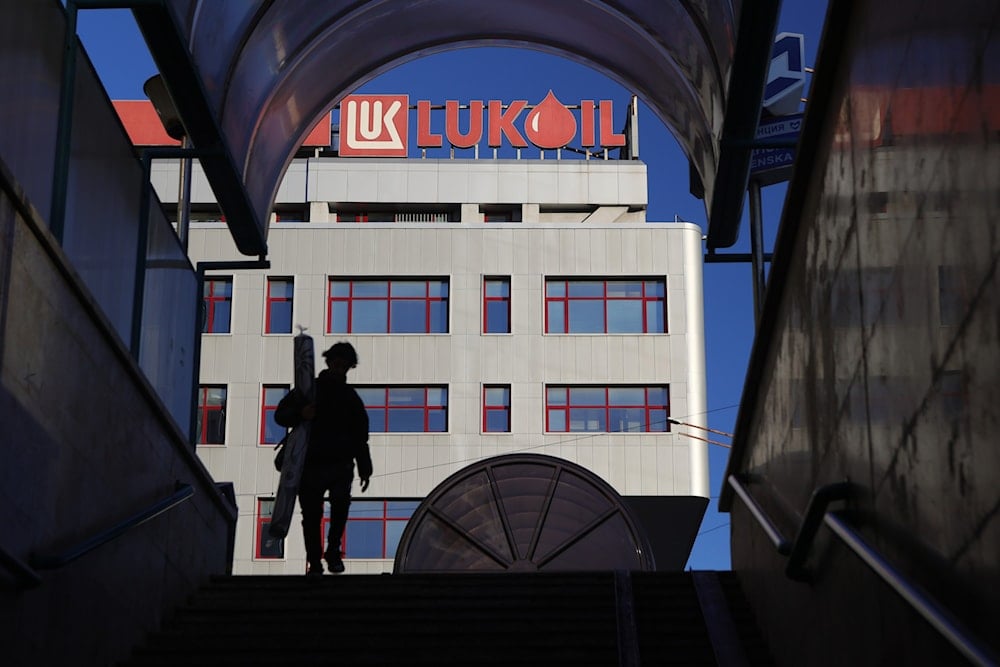 A person walks near the building of the Lukoil headquarters in Sofia, Bulgaria, Tuesday, Oct. 28, 2025 (AP)