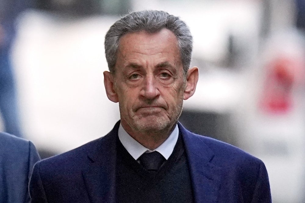 Former French President Nicolas Sarkozy leaves his home Tuesday, Oct. 21, 2025 in Paris as he heads to prison to serve time for a criminal conspiracy to finance his 2007 election campaign with funds from Libya (AP)