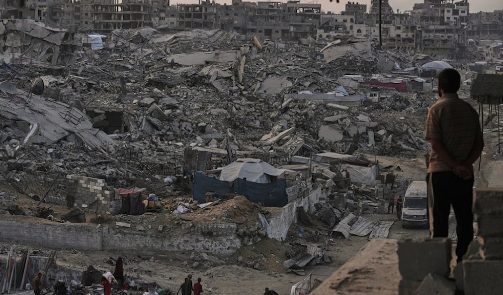 Palestinians walk through the destruction in Sheikh Radwan neighborhood in Gaza City, Tuesday, Nov. 11, 2025. (AP)