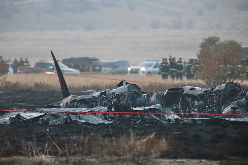 Debris is seen at a crash site of a Turkish military cargo plane in Georgia's Sighnaghi municipality, close to the Azerbaijani border on November 12, 2025. (AP Photo/Zurab Tsertsvadze)