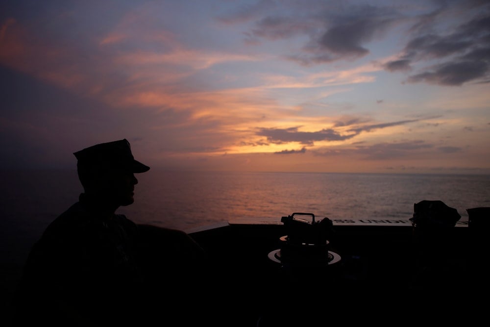 In this Oct. 11, 2012 photo, the sun rises seen from onboard the USS Underwood in international waters near Panama. (AP)