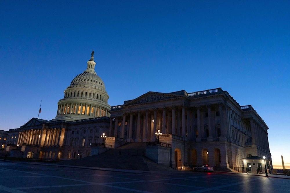 The U.S. Capitol is seen at sunset a day before the House prepares to vote on a bill to reopen the government at the Capitol in Washington, Tuesday, Nov. 11, 2025. (AP Photo/Jose Luis Magana)