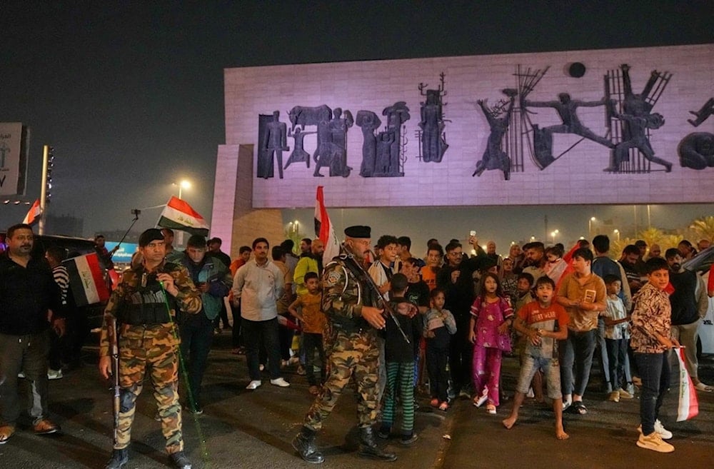 Supporters of Iraqi Prime Minister Mohammed Shia al-Sudani cheer in Tahrir Square, Baghdad, Iraq, Wednesday, November 12, 2025 (AP)