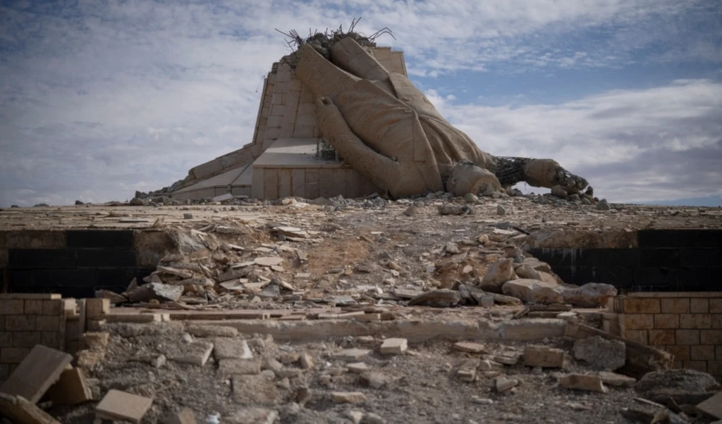 FILE - A destroyed statue of late Syrian President Hafez Assad is seen in Dayr Atiyah, Syria, on Jan. 5, 2025. (AP Photo/Leo Correa, File)