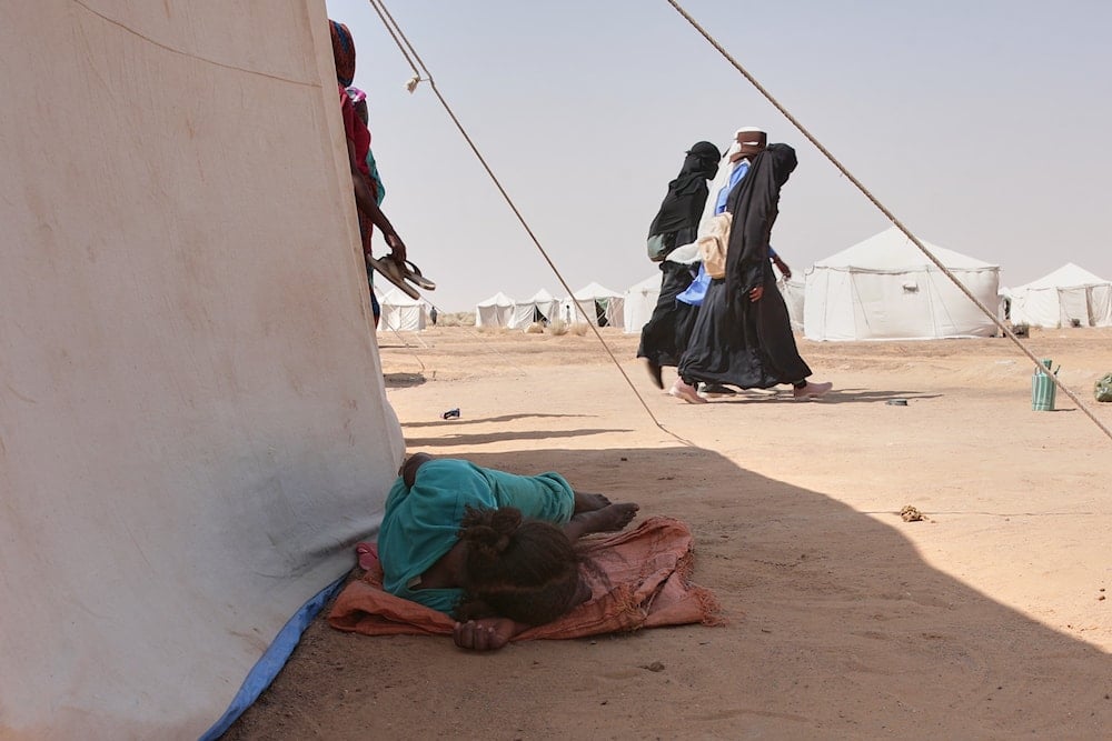 People displaced from North Darfur's capital, el-Fasher and other conflict-affected areas settle in the newly established El-Afadh camp in Al Dabbah, in Sudan's Northern State, Sudan, Thursday, Nov. 13, 2025 (AP)