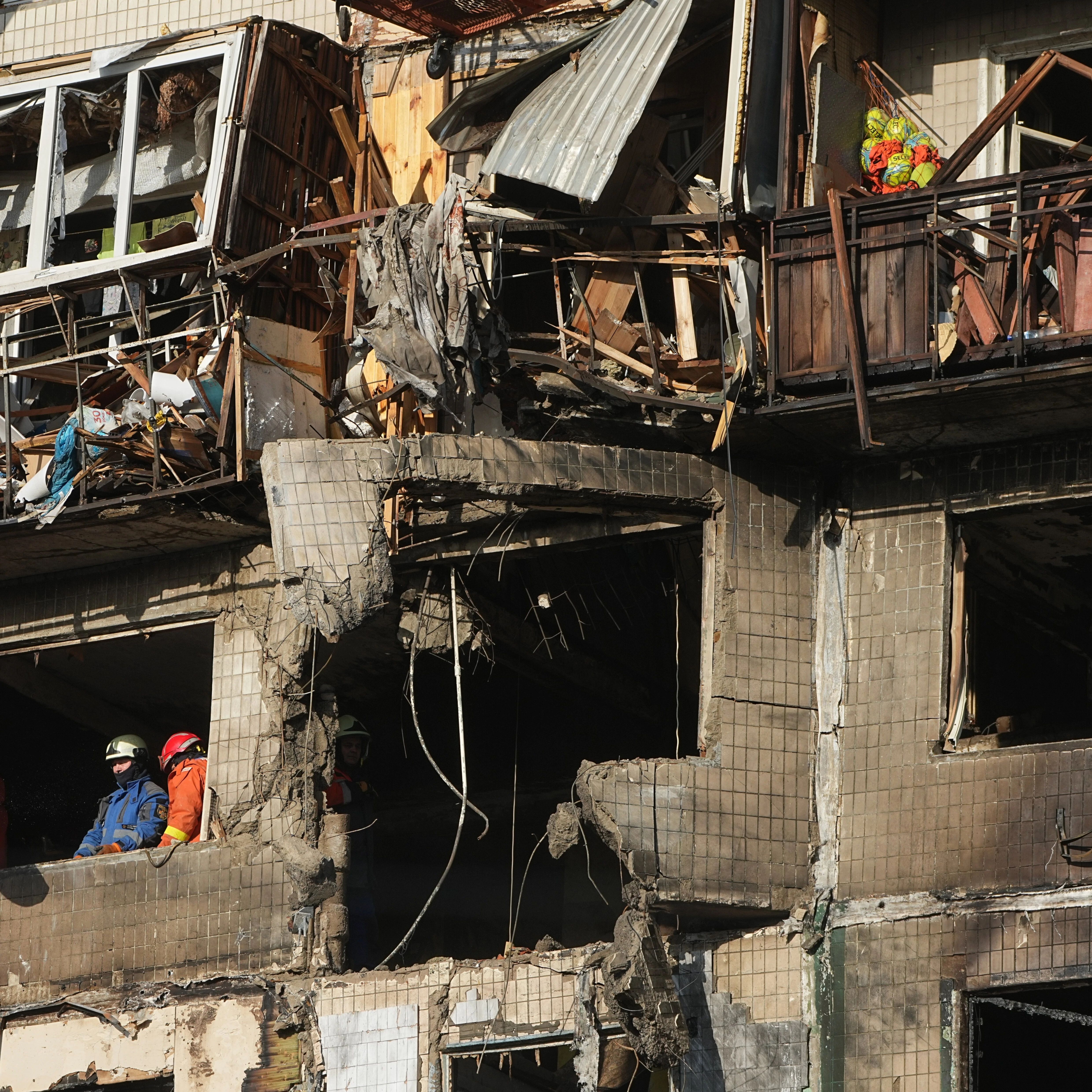 Rescuers work on the scene of a building damaged after a Russian attack in Kyiv, Ukraine, on Friday, Nov. 14, 2025 (AP)