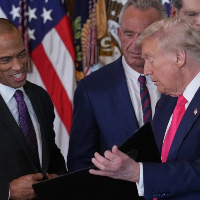 US President Donald Trump talks with Housing and Urban Development Secretary Scott Turner and Health and Human Services Secretary RFK, at an event on foster care in the East Room at the White House, Thursday, November 13, 2025, in Washington (AP)