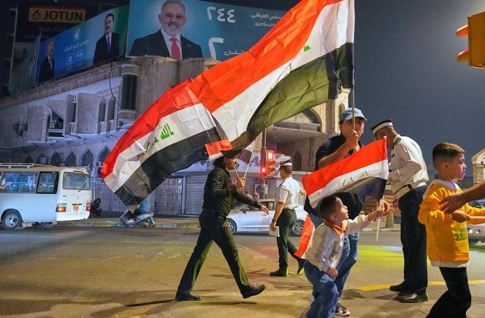 Supporters of Iraqi Prime Minister Mohammed Shia al-Sudani cheer in Tahrir Square, Baghdad, Iraq, Wednesday, Nov. 12, 2025 (AP)