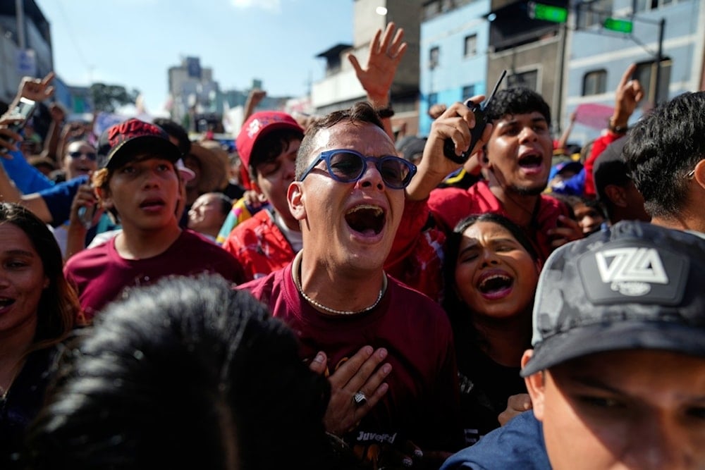 People take part in a pro-government youth rally in Caracas, Venezuela, Thursday, November 13, 2025 (AP)
