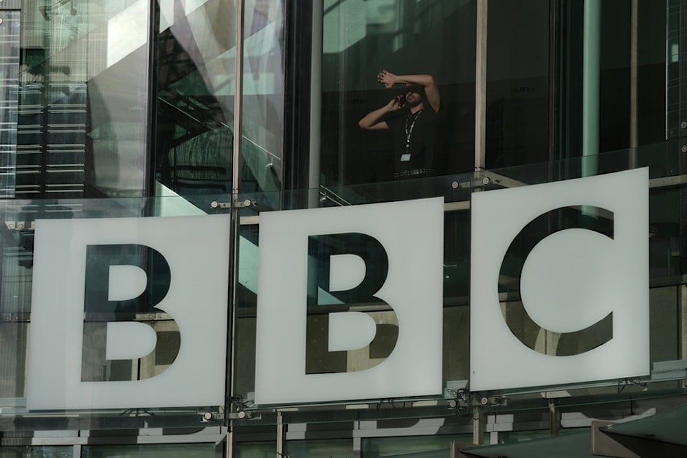 A view of the logo outside the BBC Headquarters in London, Wednesday, Nov. 12, 2025. (AP Photo/Kin Cheung)