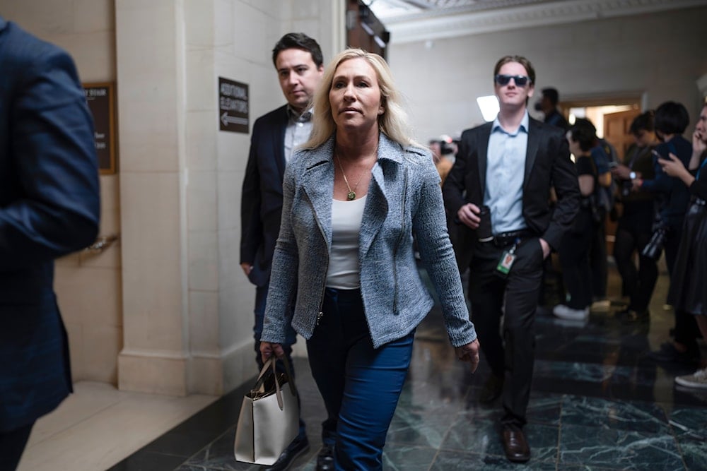 ep. Marjorie Taylor Greene, R-Ga., arrives as House Republicans hold a closed-door meeting to vote by secret ballot on their candidate for speaker of the House, at the Capitol in Washington, Wednesday, Oct. 11, 2023. (AP Photo/J. Scott Applewhite)