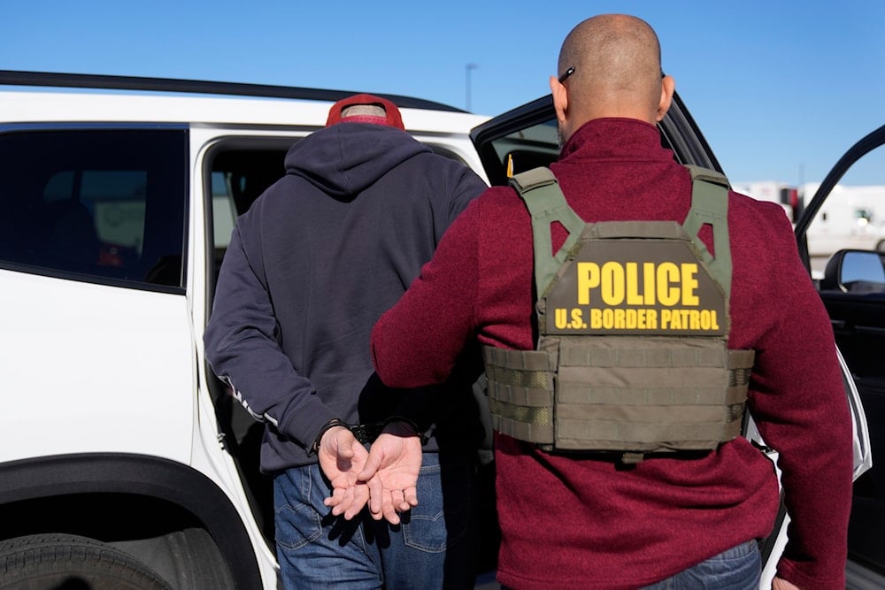U.S. Border Patrol agents detain a truck driver during an immigration enforcement operation at a truck stop on November 3, 2025, in Hampshire, Ill. (AP Photo/Erin Hooley)