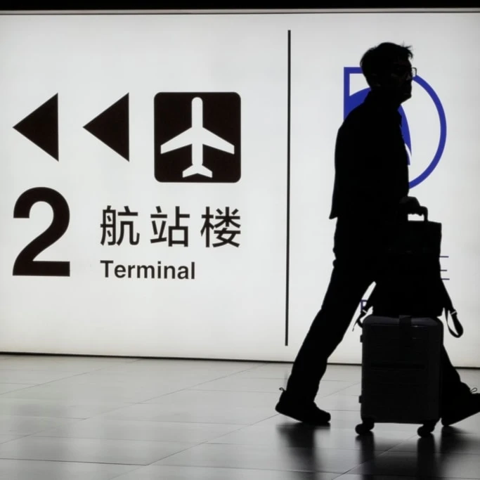 A passenger arrives at the Capital Airport in Beijing on Nov. 7, 2025. (AP Photo/Ng Han Guan)