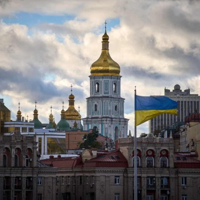 Ukrainian national flags waves on Independence square against the background of ancient St.Sophia Cathedral in central Kiev, Ukraine, Monday, Oct. 13, 2025. (AP Photo/Efrem Lukatsky)