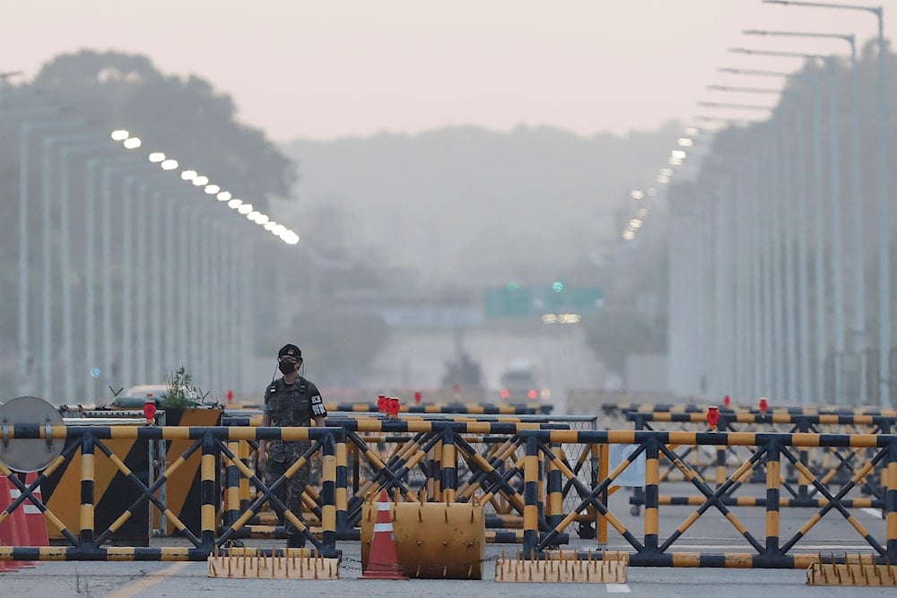 A South Korean army soldier patrols at the Unification Bridge, which leads to the Panmunjom border village in the Demilitarized Zone in Paju, South Korea. Tuesday, June 16, 2020.