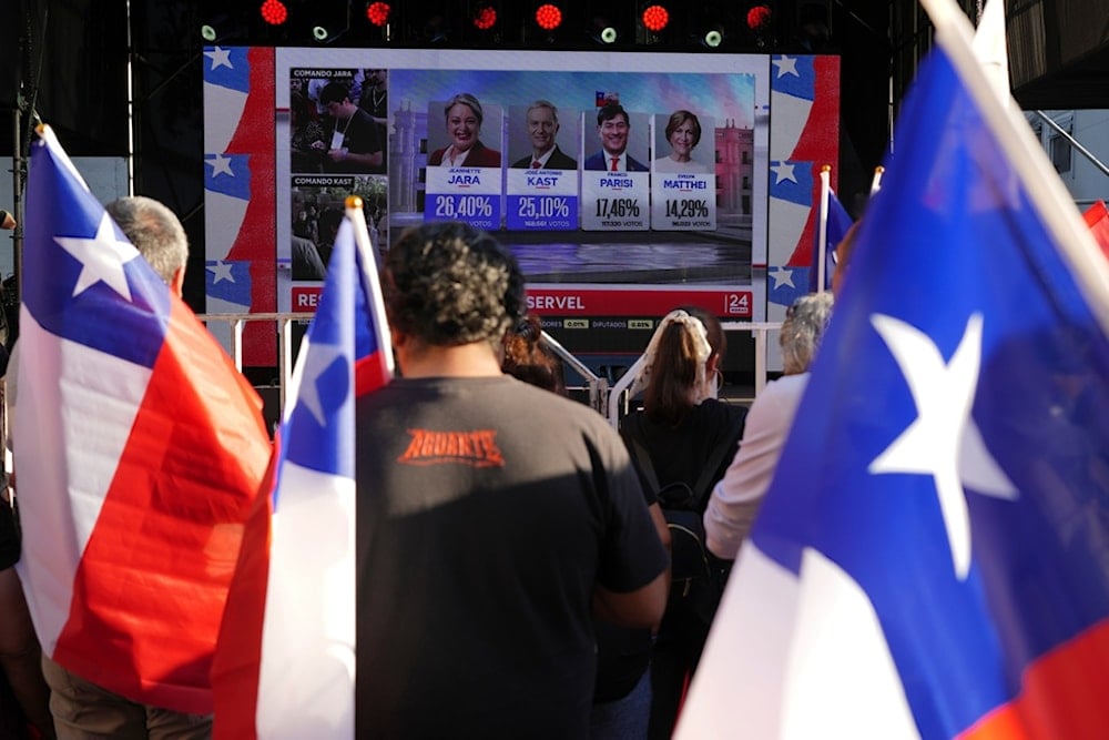 Supporters of presidential candidate Jeannette Jara of the Unidad por Chile coalition watch results come in during general elections in Santiago, Chile, Sunday, November 16, 2025. (AP Photo/Natacha Pisarenko)