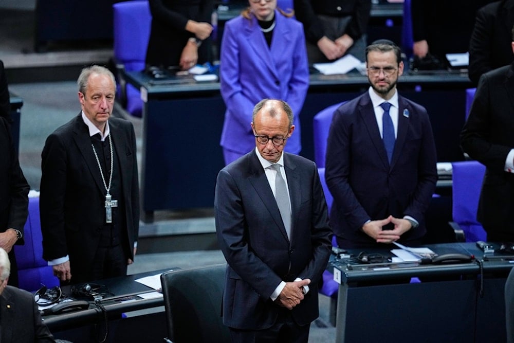 German Chancellor Friedrich Merz attends a commemoration at the German parliament Bundestag in occasion of Remembrance Day in Berlin, Germany, Sunday, November 16, 2025. (AP Photo/Ebrahim Noroozi)
