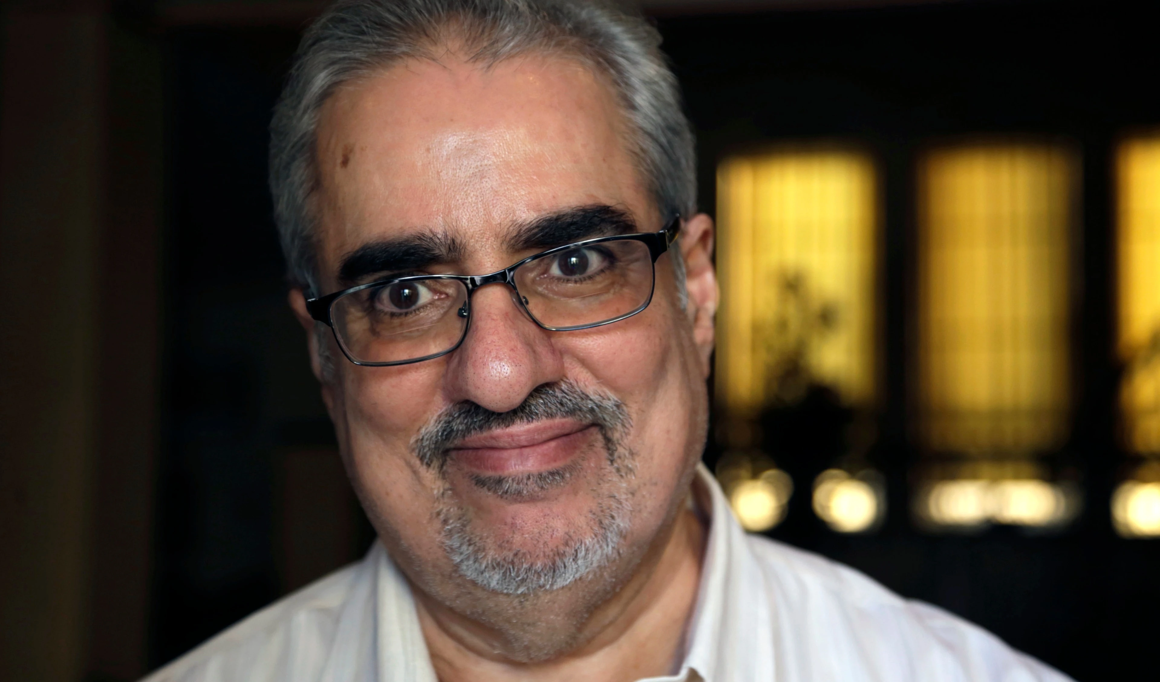 Bahraini Sunni Muslim opposition leader Ibrahim Sharif, who led the opposition National Democratic Action Society group, smiles to journalists at his home following his overnight release from prison, in Tubli, Bahrain, Saturday, June 20, 2015 (AP)