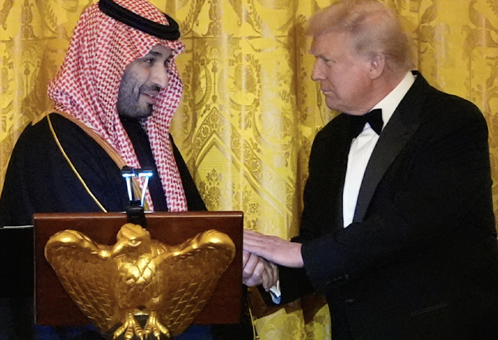 President Donald Trump shakes hands with Crown Prince  Mohammed bin Salman during a dinner in the White House on November 18, 2025. (AP)