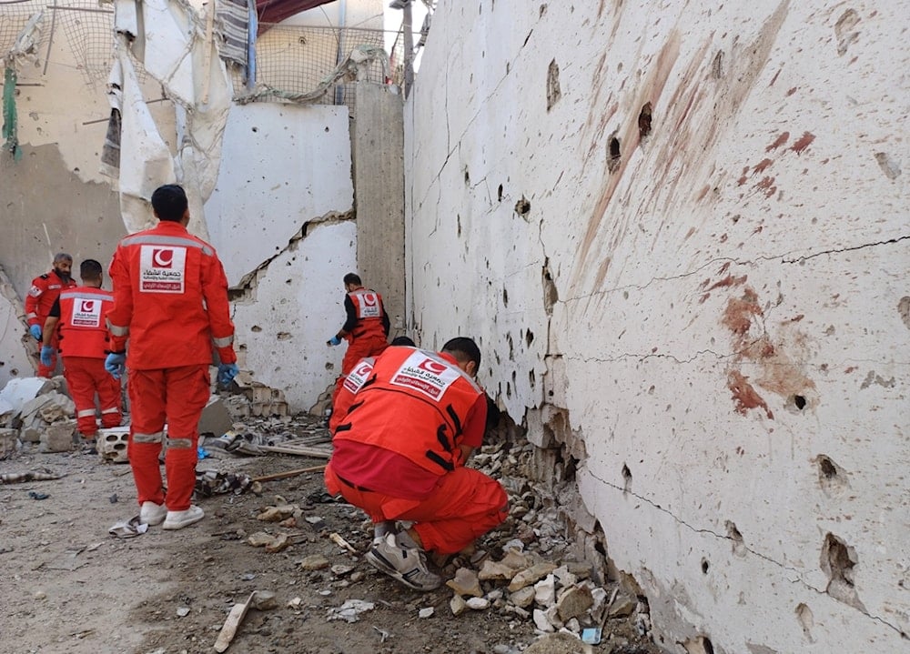 Palestinian rescue workers collect body remains at the scene where an Israeli strike on Tuesday night hit the Ein el-Hilweh Palestinian refugee camp, in the southern port city of Sidon, Lebanon, Wednesday, November 19, 2025 (AP)