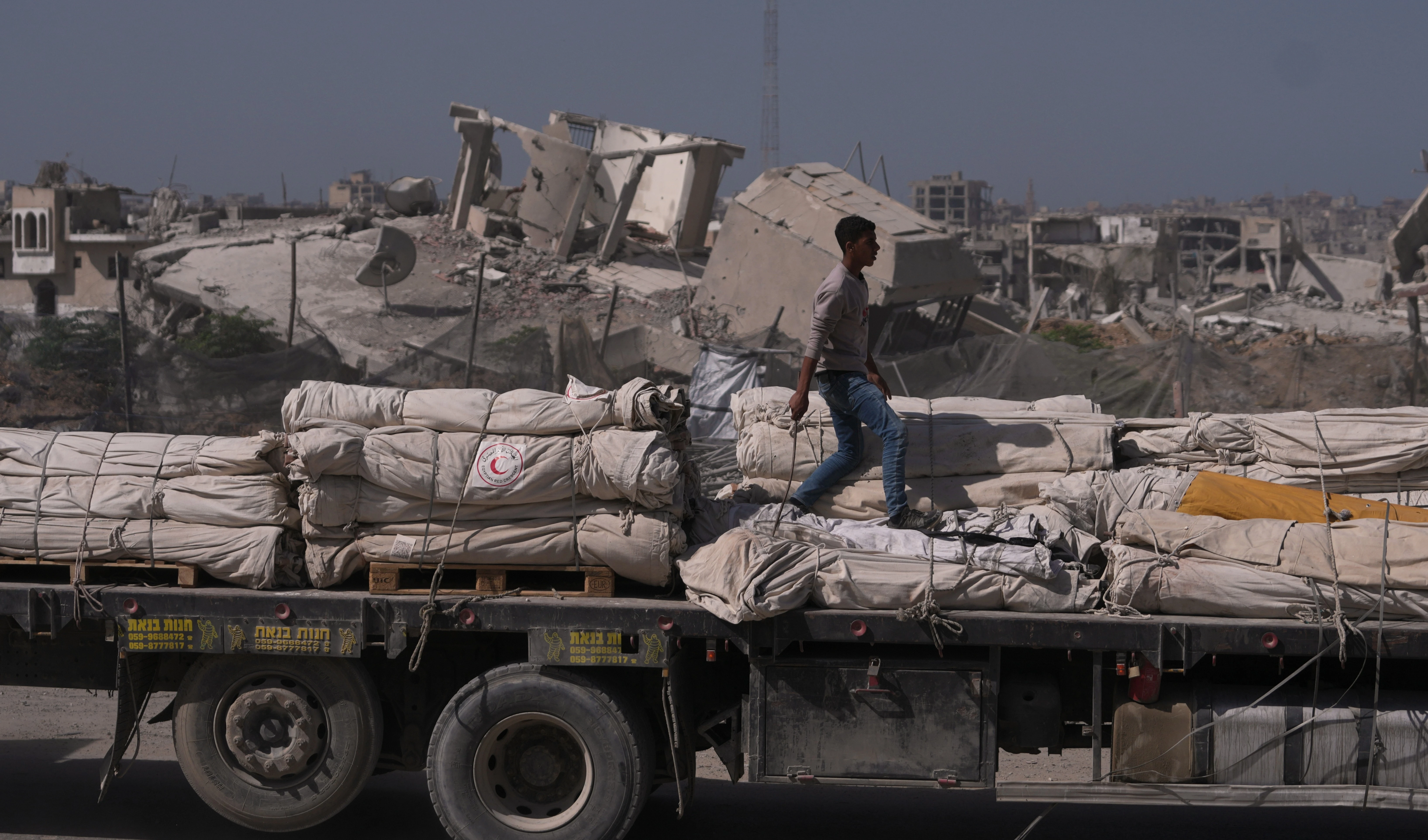 A truck carrying humanitarian aid drives through Khan Younis, in the southern Gaza Strip, Monday, Oct. 20, 2025 (AP) A truck carrying humanitarian aid drives through Khan Younis, in the southern Gaza Strip, Monday, Oct. 20, 2025 (AP)