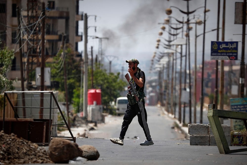 A Druze militiaman mans a checkpoint following last week's sectarian clashes in the Druze-majority town of Sweida, Syria, Friday, July 25, 2025 (AP)