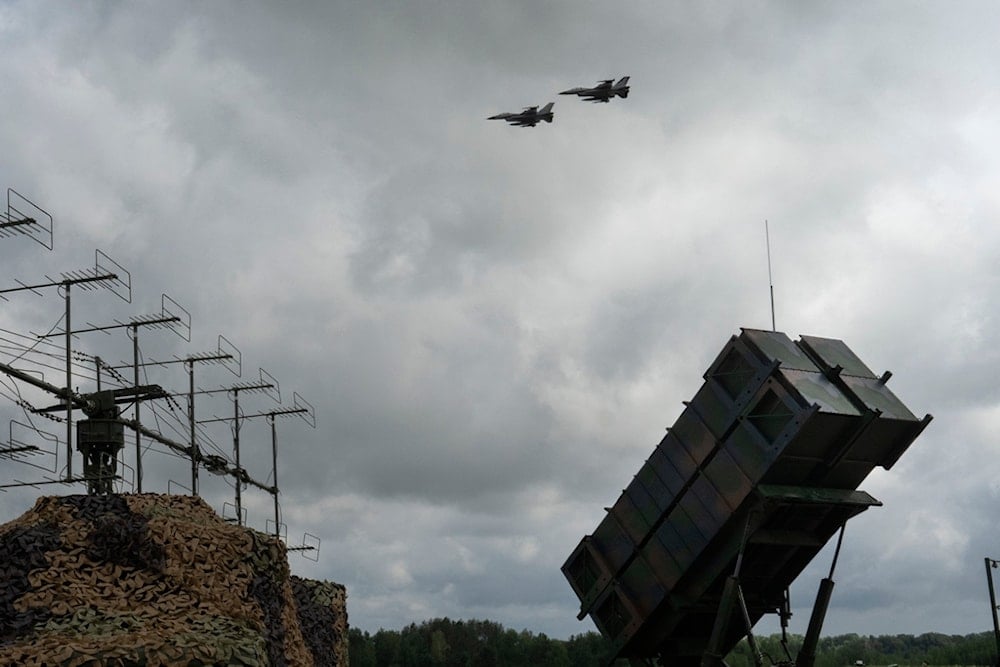 The Ukrainian Air Force's F-16 fighter jets fly over a Patriot Air and Missile Defense System in an undisclosed location in Ukraine, Sunday, Aug. 4, 2024.  (AP)