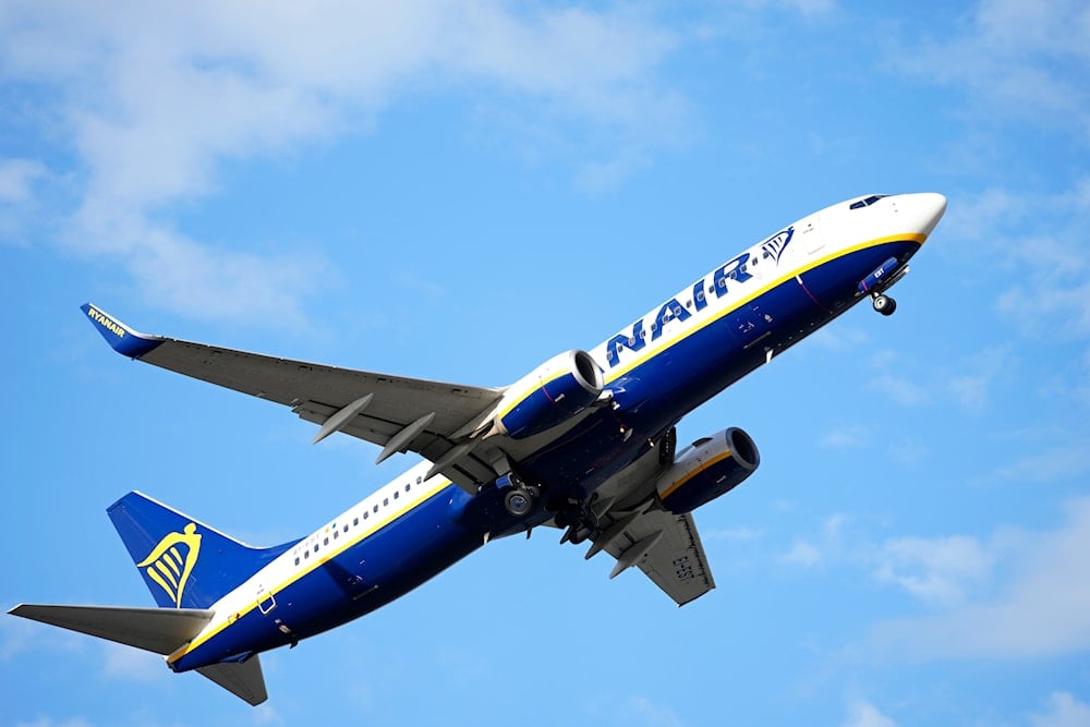 A Ryanair Boeing 737 takes off from Lisbon airport, Saturday, June 18, 2022 (AP)