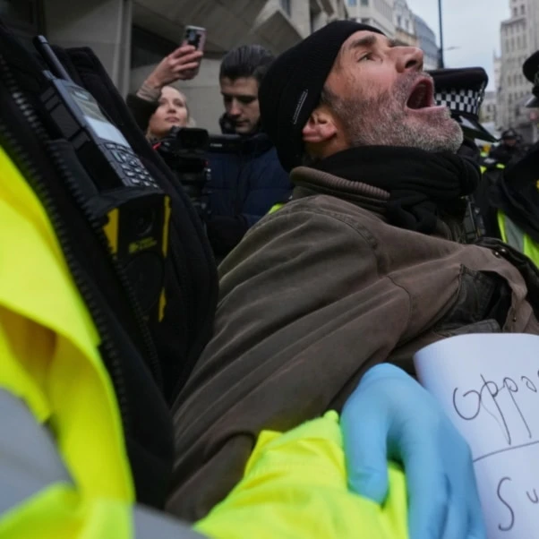Police arrest a protester outside the Ministry of Justice during a Palestine Action demonstration in London, Thursday, Nov. 20, 2025. (AP)