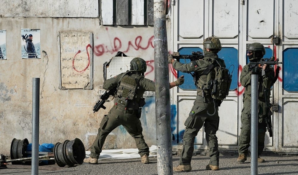 Israeli occupation soldiers during a military raid in the Palestinian West Bank city of Nablus, Thursday, Nov. 20, 2025. (AP Photo/Majdi Mohammad)