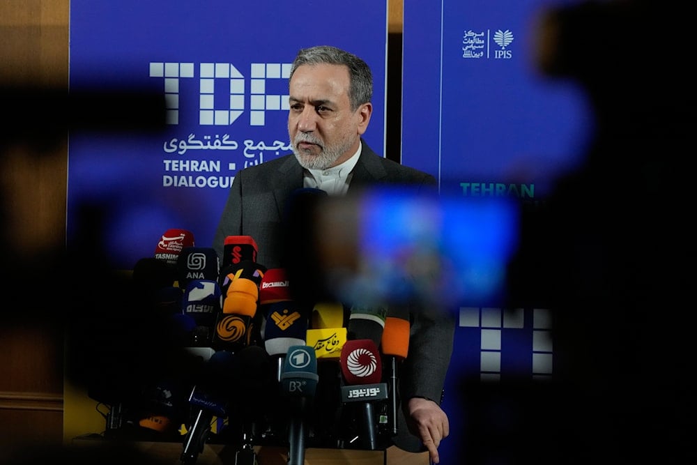 Iranian Foreign Minister Abbas Araghchi speaks in a new briefing after attending a conference titled 