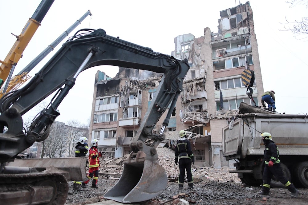 Rescue workers clear the rubble of a residential building which was heavily damaged by a Russian strike on Ternopil, Ukraine, Friday, Nov. 21, 2025 (AP)