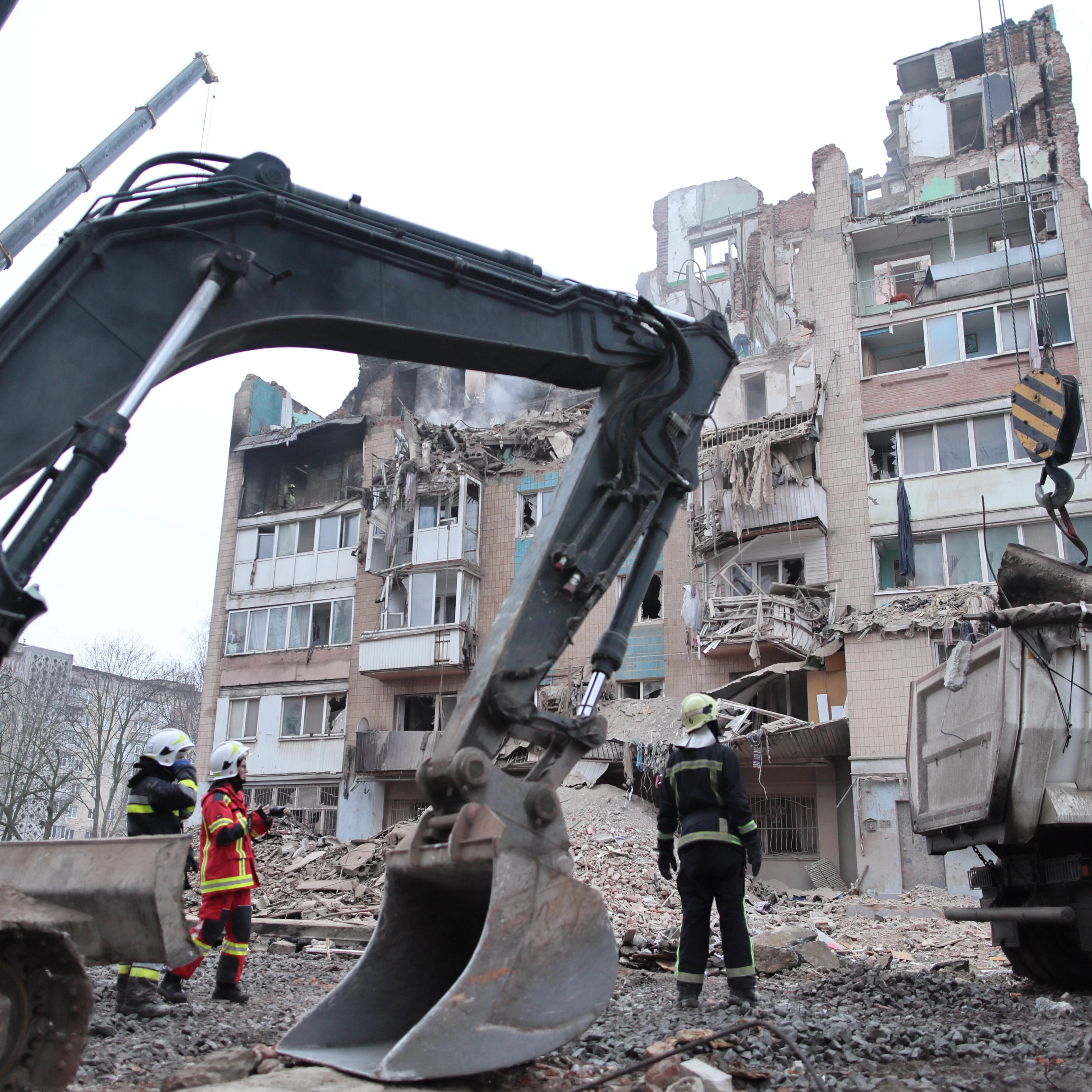 Rescue workers clear the rubble of a residential building which was heavily damaged by a Russian strike on Ternopil, Ukraine, Friday, Nov. 21, 2025 (AP)