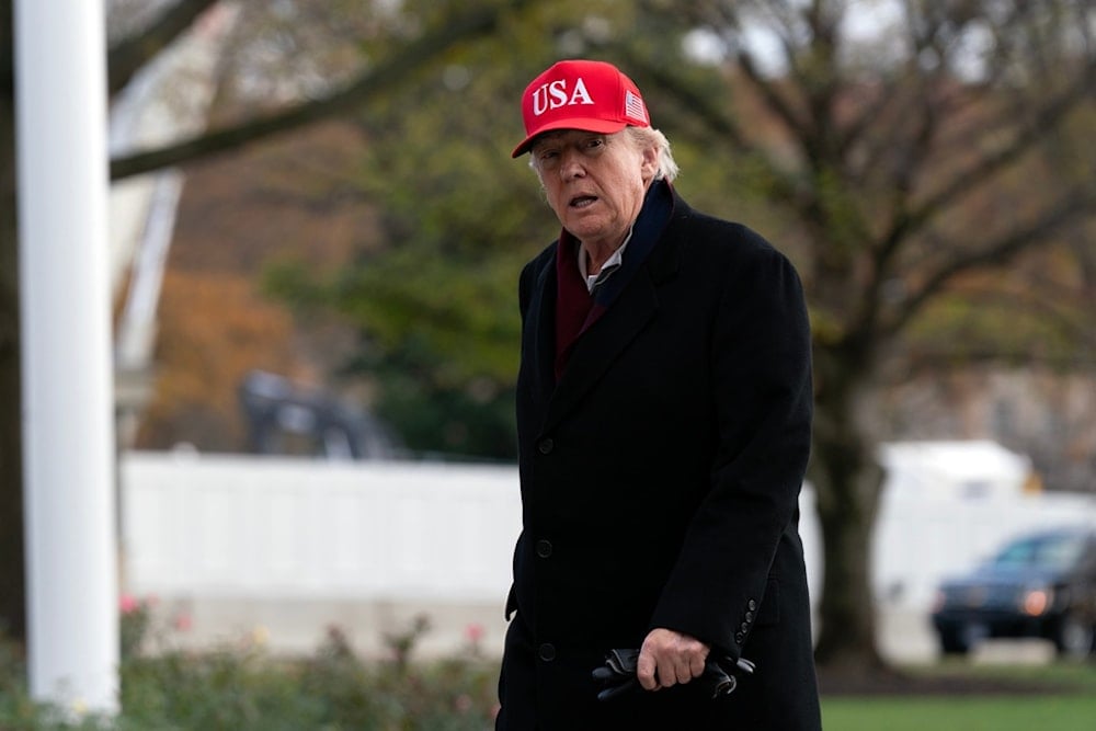 President Donald Trump walks in the South Lawn upon his arrival to the White House, Saturday, Nov. 22, 2025, in Washington. (AP Photo/Jose Luis Magana)