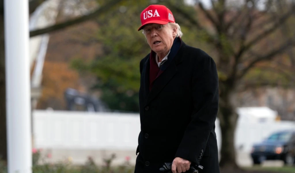 President Donald Trump walks in the South Lawn upon his arrival to the White House, Saturday, Nov. 22, 2025, in Washington. (AP Photo/Jose Luis Magana)