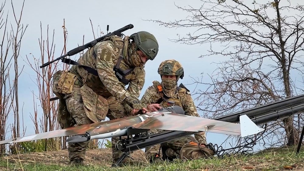 Russian soldiers prepare a drone for reconnaissance of Ukrainian positions on an undisclosed location in Ukraine, on Thursday, November 6, 2025,  (AP)