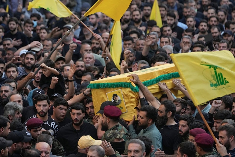 Hezbollah supporters carry the coffin of Hezbollah Chief of Staff Haytham Tabtabai during his funeral procession after he was killed in Sunday's Israeli airstrike in the southern suburb of Beirut, Lebanon, Monday, November 24, 2025 (AP)