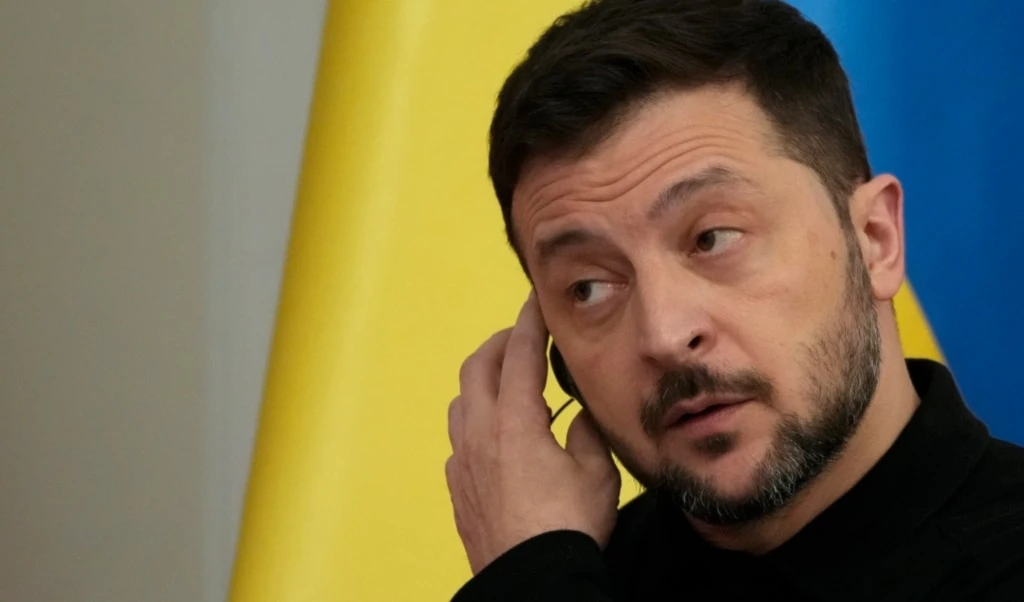 Ukrainian President Volodymyr Zelensky listens his Polish counterpart Andrzej Duda during a joint news conference in Warsaw, Poland, on Wednesday, January 15, 2025. (AP Photo/Czarek Sokolowski)