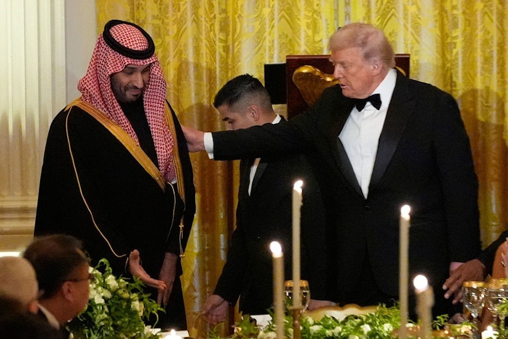 President Donald Trump and Saudi Arabia's Crown Prince Mohammed bin Salman are seated for a dinner in the East Room of the White House, Tuesday, Nov. 18, 2025, in Washington. (AP Photo/Alex Brandon)