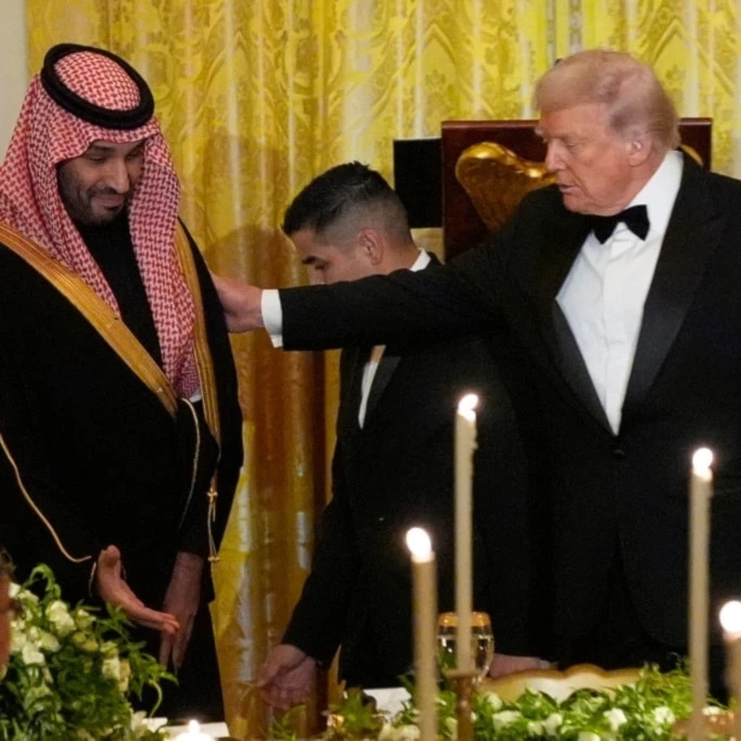 President Donald Trump and Saudi Arabia's Crown Prince Mohammed bin Salman are seated for a dinner in the East Room of the White House, Tuesday, Nov. 18, 2025, in Washington. (AP Photo/Alex Brandon)