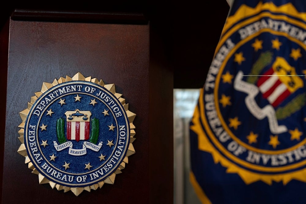 An FBI seal is displayed on a podium before a news conference at the field office in Portland, Ore., Thursday, Jan. 16, 2025. (AP Photo/Jenny Kane)